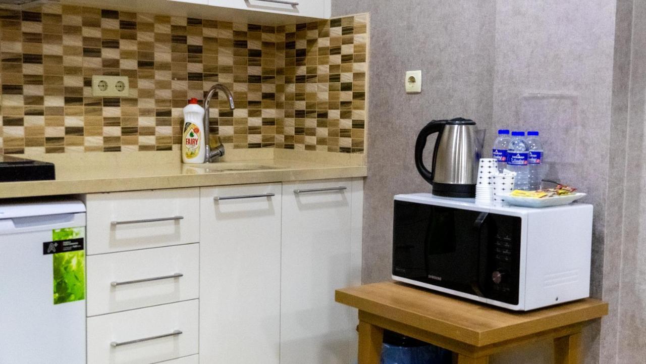 Bursa Suites Apart Otel Exterior foto A microwave oven in a kitchen