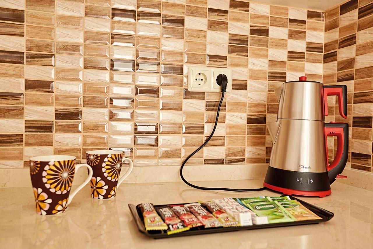 Bursa Suites Apart Otel Exterior foto A kettle plugged into a wall socket